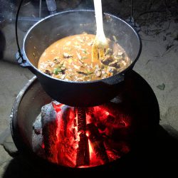 preparing food at Tropical Woopen Creek Camping